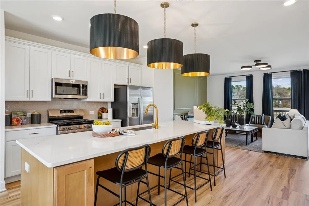 Midtown Rows model kitchen with a large island and white cabinetry